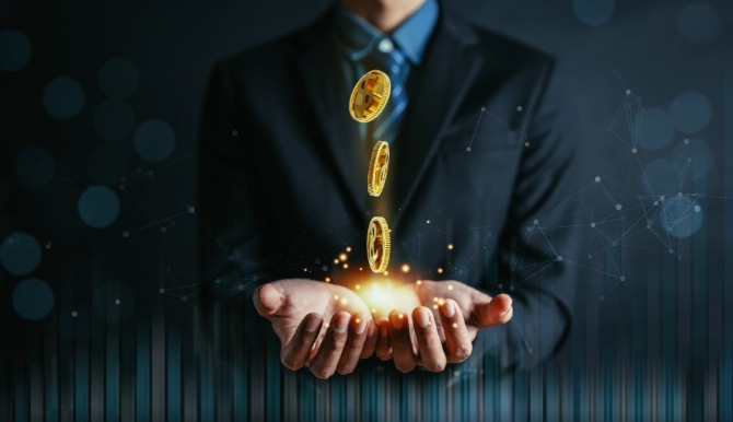 A composite image showing coins falling into open hands