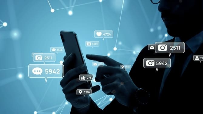 Man using a smartphone with floating social media and message icons, illustrating phone number scams, phishing, and account takeover risks.