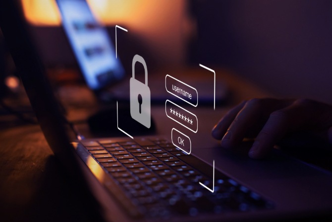 An image of a person typing a strong passphrase into their computer.