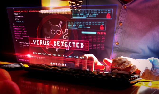 A computer showing a virus has been detected and is spreading.