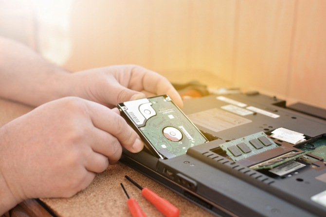 Engineer checks hard drive health.