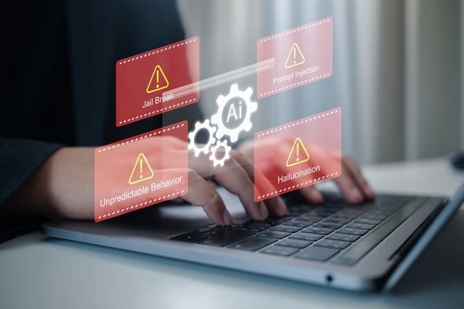 Business Hands typing on Laptop with warning Icons showing ai risks like jailbreak prompt injection