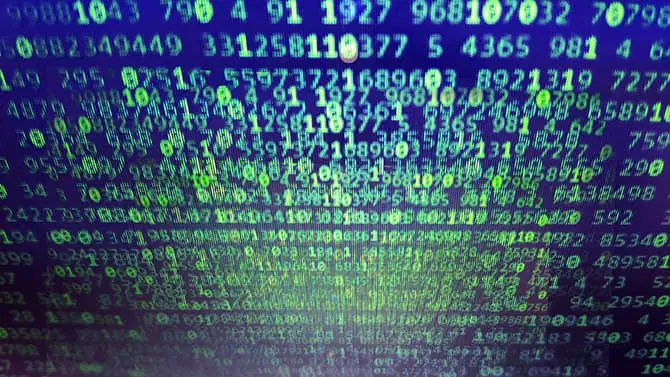 an image of a computer screen with scattered numbers, suggesting a data breach