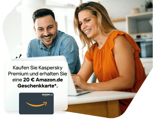 Happy couple smiling while browsing on a laptop