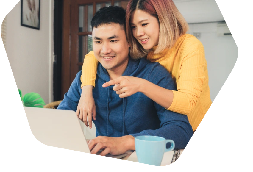 Young couple using their tablets at home