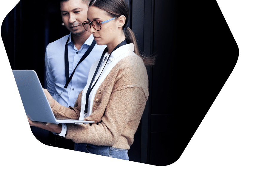 Man and woman viewing office servers