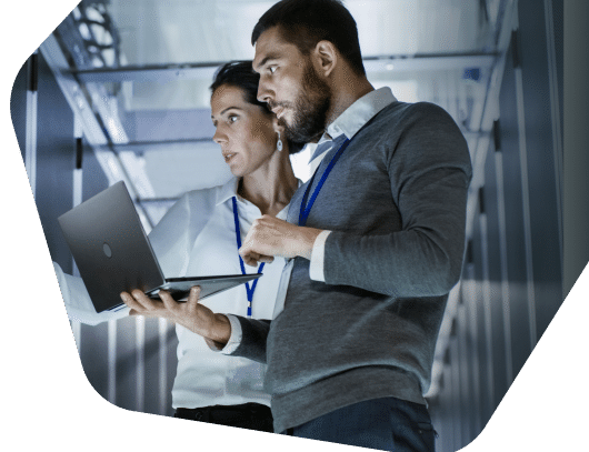 Man and woman viewing office servers