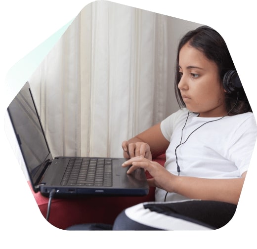 Boy watching YouTube safely on a laptop using Kaspersky Safe Kids