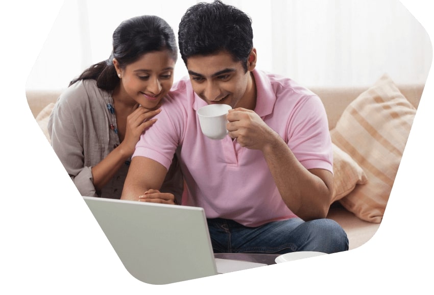 Man and woman browsing online with laptop